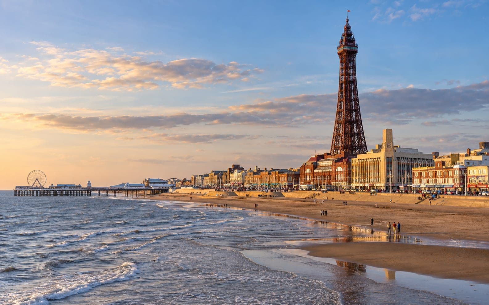 Blackpool Tower rising above the promenade and beach