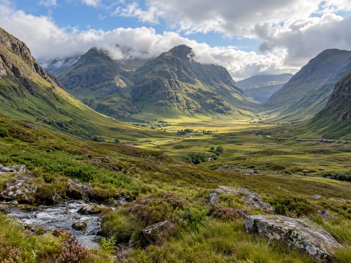 Cloud sitting low over the steep sides of Glencoe in the Scottish Highlands